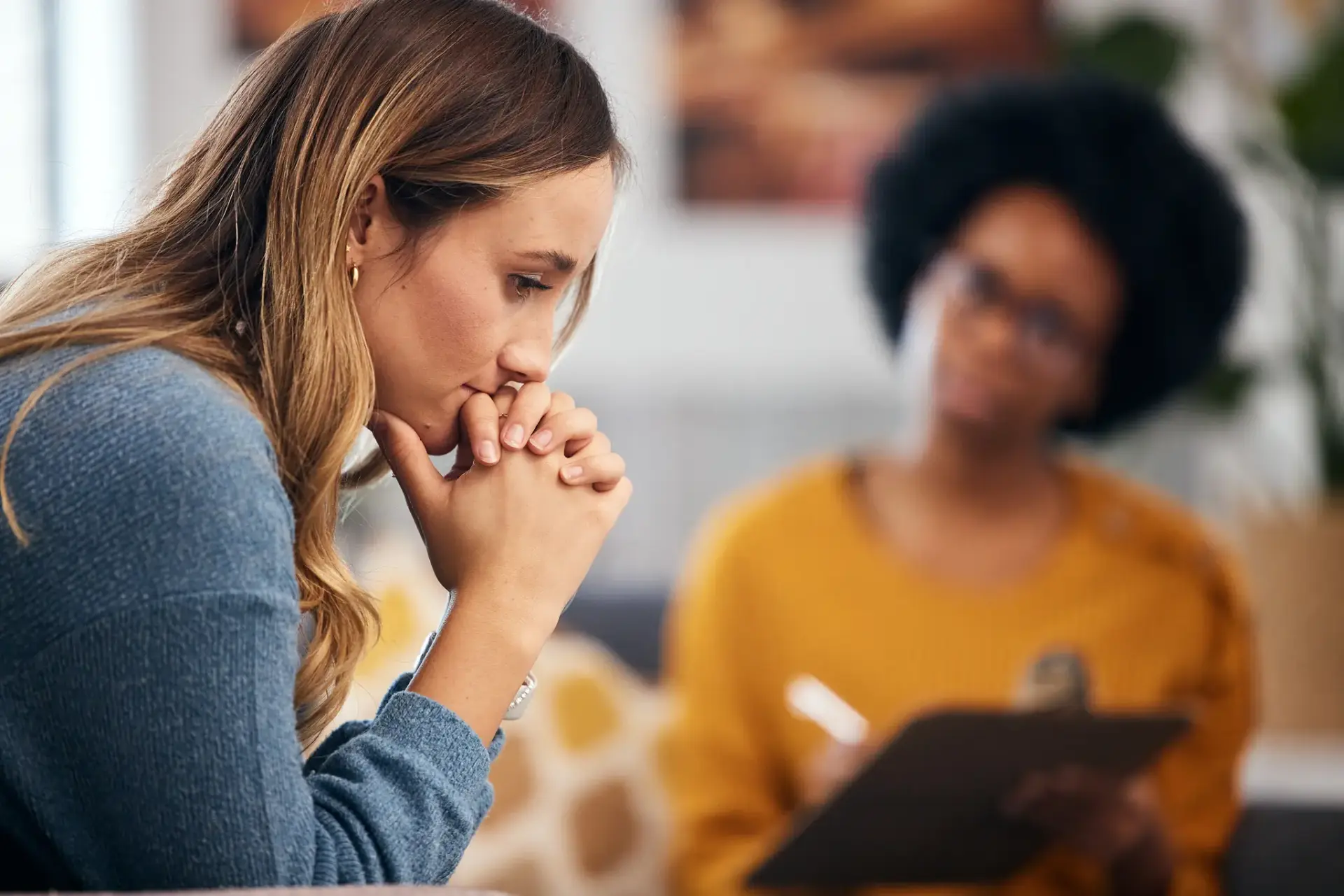 Woman thinking during a therapy session.