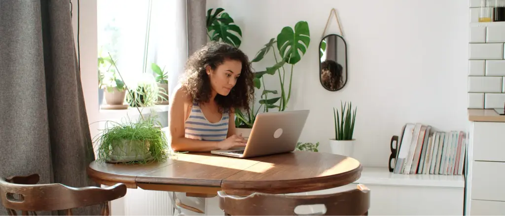 A young woman searching online for a therapist in Austin